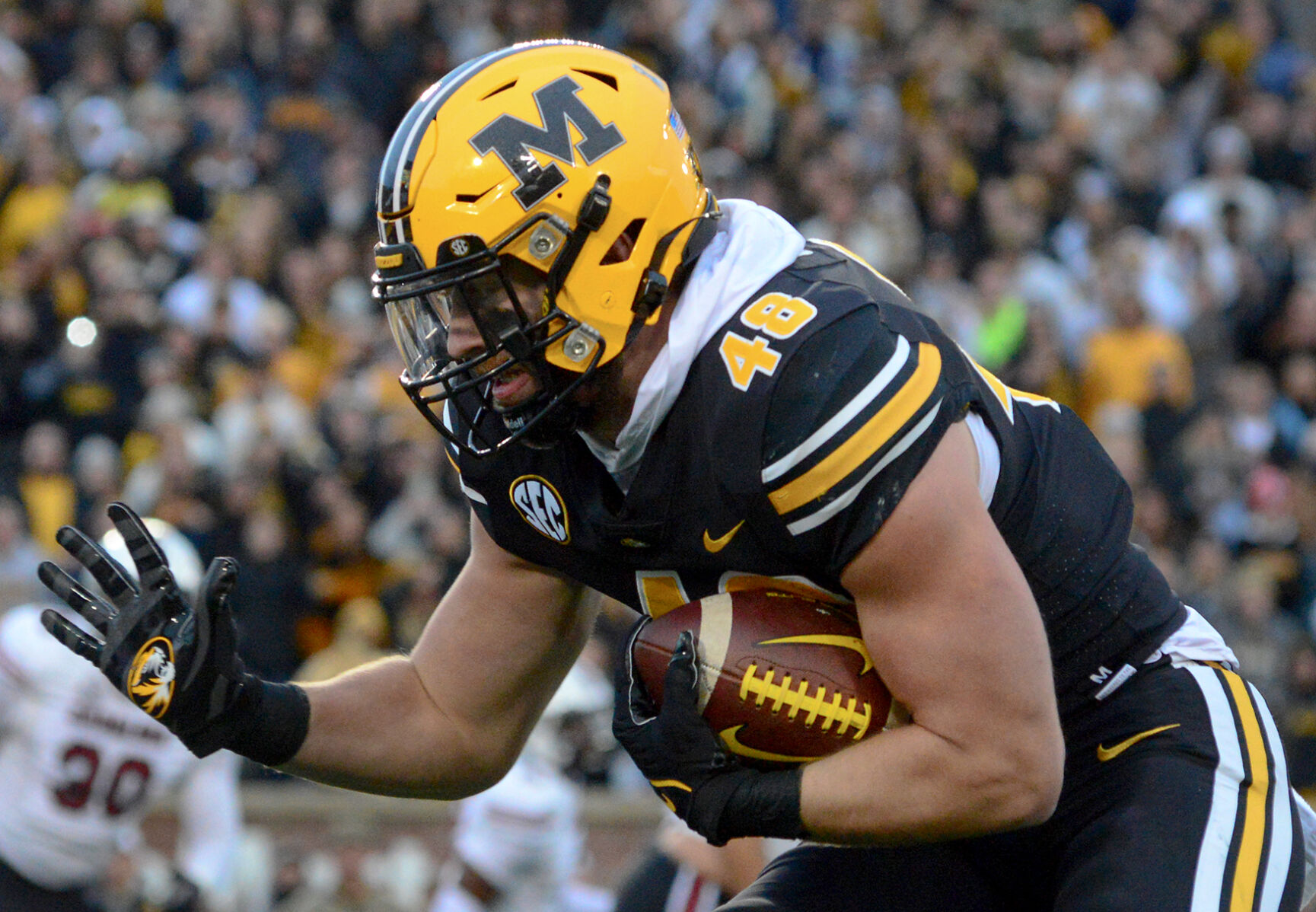 Niko Hea runs with the ball